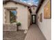 Inviting entryway with a tiled walkway and decorative stone accents at 1805 E Atole Pl, Queen Creek, AZ 85140