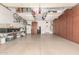 Clean garage features epoxy floors and ample storage cabinets, providing organized space for vehicles and belongings at 1805 E Atole Pl, Queen Creek, AZ 85140