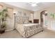 Comfortable main bedroom featuring carpet, a ceiling fan, a walk-in shower, and ensuite bathroom at 1805 E Atole Pl, Queen Creek, AZ 85140