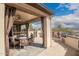 Outdoor covered patio with dining area and built-in BBQ, perfect for entertaining at 1805 E Atole Pl, Queen Creek, AZ 85140