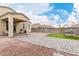 Beautiful backyard with stone pavers, artificial turf, and desert landscaping at 18400 E Donato Dr, Gold Canyon, AZ 85118