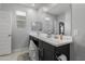 Bright bathroom with double sinks, a large mirror, and modern fixtures creating a clean space at 18400 E Donato Dr, Gold Canyon, AZ 85118