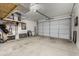 Clean and organized garage featuring overhead storage and ample workspace at 18400 E Donato Dr, Gold Canyon, AZ 85118