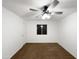 Clean bedroom featuring plush carpet, a ceiling fan, and a window for natural light at 1942 S Emerson -- # 217, Mesa, AZ 85210