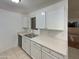 Kitchen featuring a stainless steel sink, ample counter space, and bright overhead lighting at 1942 S Emerson -- # 217, Mesa, AZ 85210