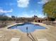 Community pool with lounge chairs and a covered seating area in a relaxing setting at 1942 S Emerson -- # 217, Mesa, AZ 85210