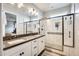 Bright bathroom featuring a double sink vanity, large glass-enclosed shower, and modern finishes at 1950 E Lantana Dr, Chandler, AZ 85286