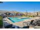 Large community pool with plenty of lounge chairs and clear blue water for relaxation and recreation at 1950 E Lantana Dr, Chandler, AZ 85286