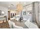 The spacious dining area featuring stylish decor and a modern chandelier for a cozy and elegant ambiance at 1950 E Lantana Dr, Chandler, AZ 85286