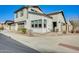 Exterior angle view of a two-story home with desert landscaping and a two-car garage at 1950 E Lantana Dr, Chandler, AZ 85286