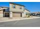 Charming two-story home featuring a brick driveway, and a two-car garage, under a clear blue sky at 1950 E Lantana Dr, Chandler, AZ 85286