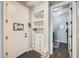 Mud room with a built-in storage shelf and bench seating, as well as a door to the laundry room at 1950 E Lantana Dr, Chandler, AZ 85286