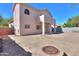 Backyard showcasing a patio, gravel, fire pit, and a two-story home elevation at 1980 N Santa Fe Ct, Casa Grande, AZ 85122