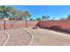 Large backyard offers gravel landscaping, a cozy fire pit area, and a secure perimeter block wall at 1980 N Santa Fe Ct, Casa Grande, AZ 85122