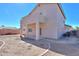 Spacious backyard featuring a covered patio and gravel landscaping, perfect for outdoor entertaining at 1980 N Santa Fe Ct, Casa Grande, AZ 85122