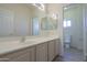 Bathroom featuring a vanity with sink, a large mirror, and a toilet in a separate area at 1980 N Santa Fe Ct, Casa Grande, AZ 85122