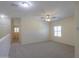 Large bedroom with neutral carpet, ceiling fan, and plantation shutters for ample light control at 1980 N Santa Fe Ct, Casa Grande, AZ 85122