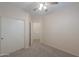 Comfortable bedroom with a ceiling fan, carpet, and closet at 1980 N Santa Fe Ct, Casa Grande, AZ 85122