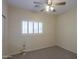 Cozy bedroom with neutral carpet, plantation shutters, and a decorative table lamp at 1980 N Santa Fe Ct, Casa Grande, AZ 85122