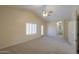 Bright bonus room with neutral carpet, vaulted ceiling, plantation shutters, and convenient access to other rooms at 1980 N Santa Fe Ct, Casa Grande, AZ 85122