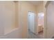 Hallway with neutral tones, tile flooring, and easy access to other rooms at 1980 N Santa Fe Ct, Casa Grande, AZ 85122