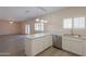 Open concept kitchen with breakfast bar and a view of the living area at 1980 N Santa Fe Ct, Casa Grande, AZ 85122