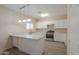 Updated kitchen featuring stainless steel appliances, tile flooring, and white cabinets at 1980 N Santa Fe Ct, Casa Grande, AZ 85122