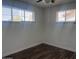 Bedroom with hardwood floors, large windows, and a ceiling fan at 2031 E Don Carlos Ave, Tempe, AZ 85281