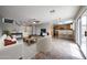 Open concept living space with a view of the kitchen and dining area with tile flooring at 22473 W Woodlands Ave, Buckeye, AZ 85326