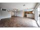 Open concept living space with tile flooring and a view of the kitchen at 22473 W Woodlands Ave, Buckeye, AZ 85326