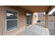 Covered patio area with a view of the backyard and access to the home's interior at 22473 W Woodlands Ave, Buckeye, AZ 85326