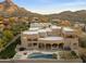 Aerial view of the desert home showcasing the pool, patio, and mountain scenery at 24019 N 112Th Pl, Scottsdale, AZ 85255