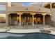 Beautiful backyard pool with covered patio and desert landscaping creating an outdoor oasis at 24019 N 112Th Pl, Scottsdale, AZ 85255