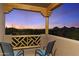 Balcony with stunning sunset views and cozy seating offers an outdoor escape at 24019 N 112Th Pl, Scottsdale, AZ 85255