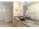 Bathroom featuring a vessel sink, granite countertop, and large mirror at 24019 N 112Th Pl, Scottsdale, AZ 85255