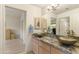 Bathroom with dual vessel sinks, granite countertops, and warm lighting at 24019 N 112Th Pl, Scottsdale, AZ 85255