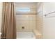 Bathroom with a tiled shower and bath combination at 24019 N 112Th Pl, Scottsdale, AZ 85255