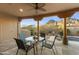 Enjoy the covered patio overlooking a sparkling pool, lush landscaping, and beautiful desert mountain views at 24019 N 112Th Pl, Scottsdale, AZ 85255