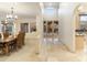 Open view of the dining room and entry featuring tile flooring, and tall ceilings at 24019 N 112Th Pl, Scottsdale, AZ 85255