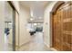 Hallway with natural light leading to a bedroom and a private balcony with mountain views at 24019 N 112Th Pl, Scottsdale, AZ 85255