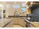 Kitchen showcasing granite countertops, stainless steel appliances, and a large view window at 24019 N 112Th Pl, Scottsdale, AZ 85255