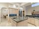 Bright kitchen featuring an island, stainless steel appliances, and tile backsplash at 24019 N 112Th Pl, Scottsdale, AZ 85255