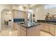 Spacious kitchen featuring a large island with granite countertops and stainless steel appliances at 24019 N 112Th Pl, Scottsdale, AZ 85255