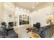 Bright living room with a fireplace, built-in shelving and entertainment center, and comfortable seating at 24019 N 112Th Pl, Scottsdale, AZ 85255