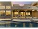 Beautiful covered patio next to the pool features comfortable seating and stunning views at 24019 N 112Th Pl, Scottsdale, AZ 85255