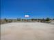 Outdoor basketball court with hoop and seating at 24183 W Hidalgo Ave, Buckeye, AZ 85326