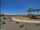 Neighborhood playground with swings, slides, and shaded seating at 24183 W Hidalgo Ave, Buckeye, AZ 85326