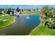 Beautiful golf course aerial view showcasing a picturesque pond and manicured greens at 25820 S Saddletree Dr, Sun Lakes, AZ 85248