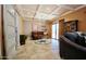 Comfortable living room with a coffered ceiling, tile floors, and sliding glass doors at 25820 S Saddletree Dr, Sun Lakes, AZ 85248