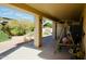 Covered patio with outdoor seating and views of the private backyard at 25820 S Saddletree Dr, Sun Lakes, AZ 85248